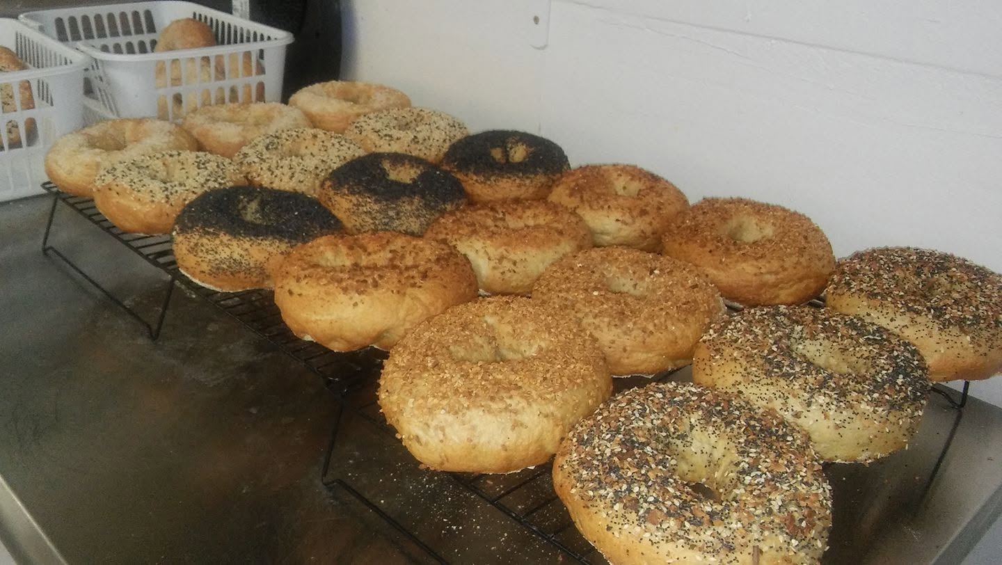 Fresh bagels cooling on a wire rack