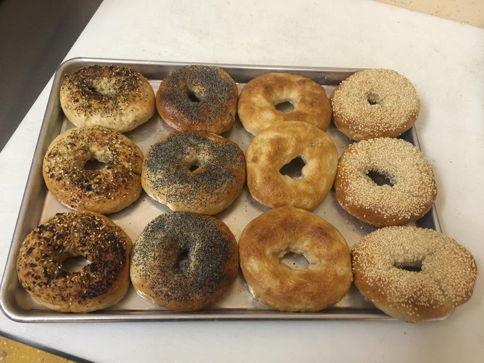 A fresh tray of hand-rolled bagels